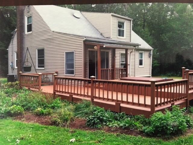135 Hamel Road Renfrew, PA 16053 - Photo 19 of 21 View of the back of the house in the summer with all the flowering shrubs and notice the beautiful canopy of leaves on the trees in the back ground.