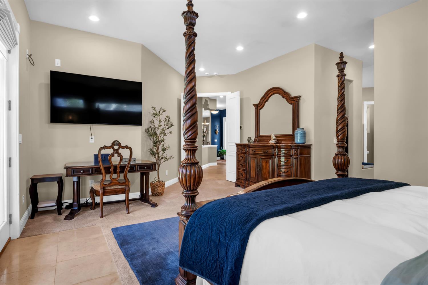 2847 Sierra Vista Road Rescue, CA 95672 - Photo 33 of 69 a bedroom with a bed a flat screen tv and a large window