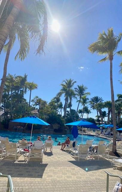 9225 Museo Circle, Unit 203 Naples, FL 34114 - Photo 20 of 21 a swimming pool with outdoor seating yard and outdoor seating