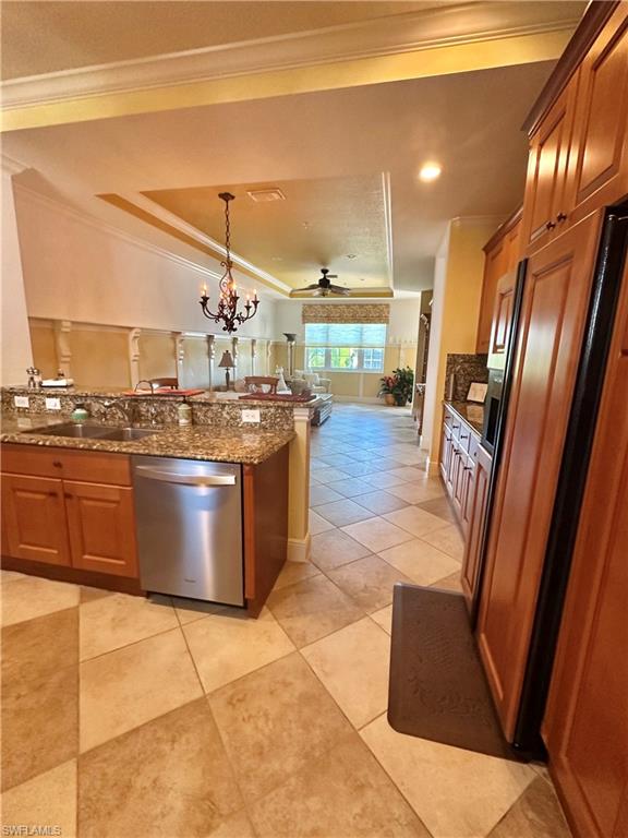 9225 Museo Circle, Unit 203 Naples, FL 34114 - Photo 6 of 21 a kitchen with stainless steel appliances granite countertop a stove a sink and a refrigerator