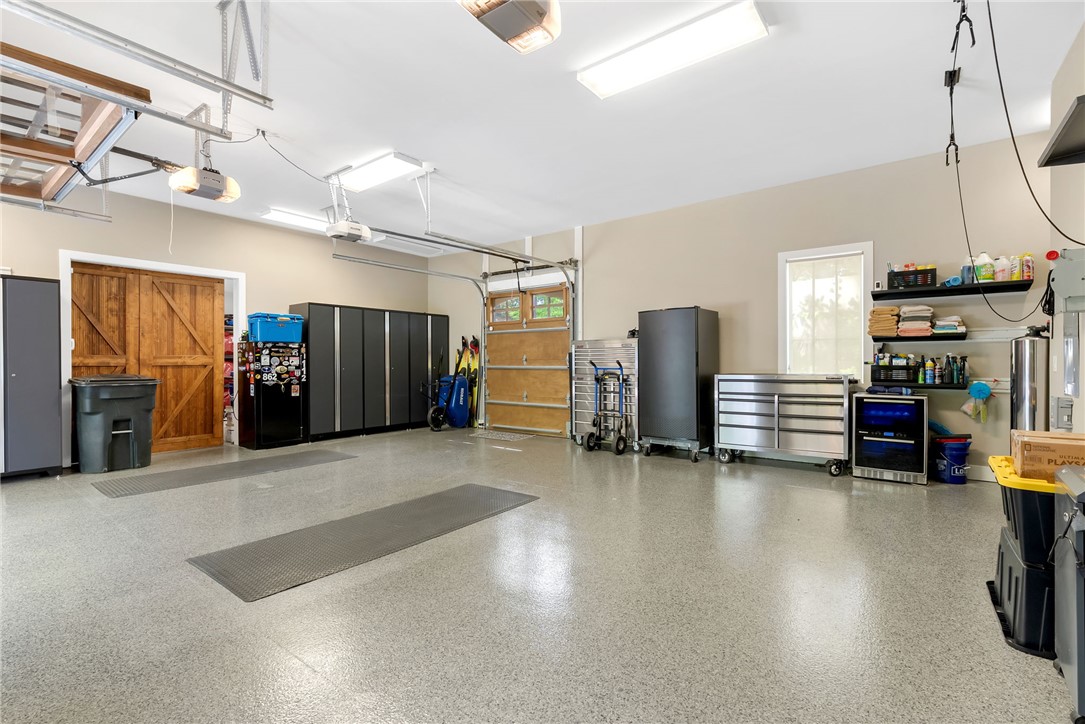 119 Drewberry Lane Sunset, SC 29685 - Photo 32 of 42 This spacious garage offers ample room for vehicles and storage, featuring durable flooring and functional organization.