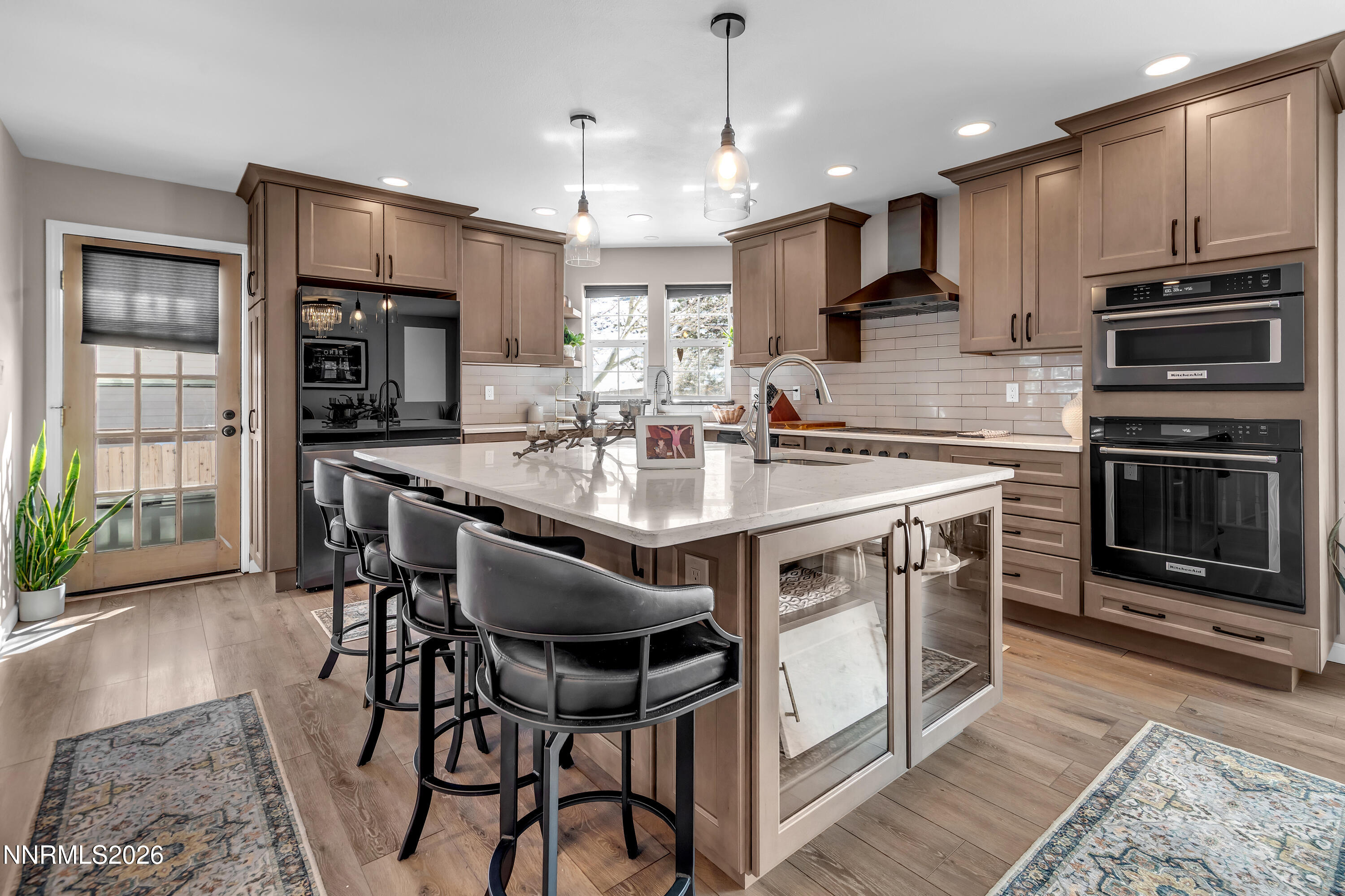 2677 Chaparral Drive Reno, NV 89509 - Photo 2 of 35 a kitchen with stainless steel appliances granite countertop a stove top oven a sink refrigerator and cabinets
