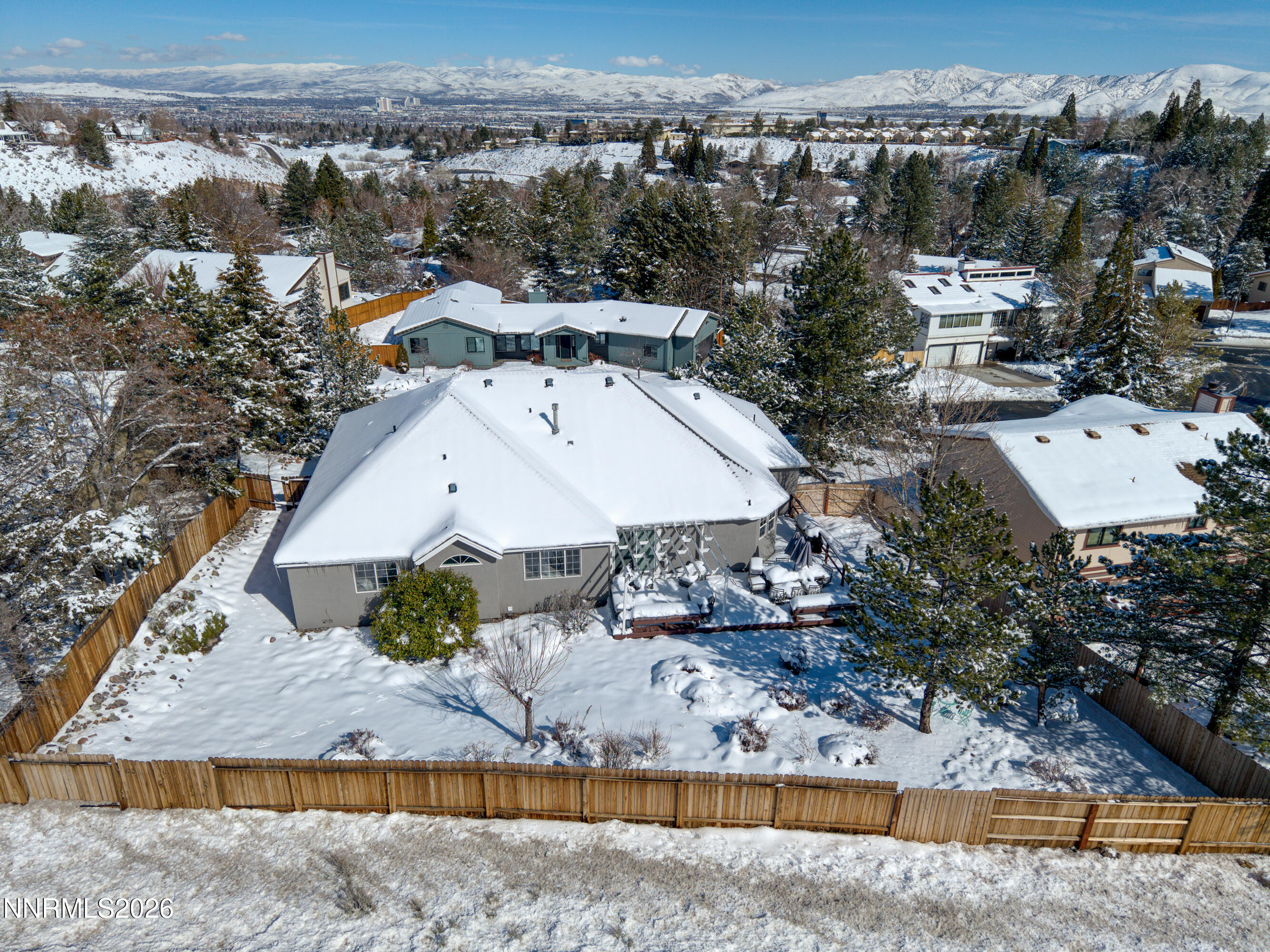 2677 Chaparral Drive Reno, NV 89509 - Photo 28 of 35 an aerial view of a house with a yard and large trees