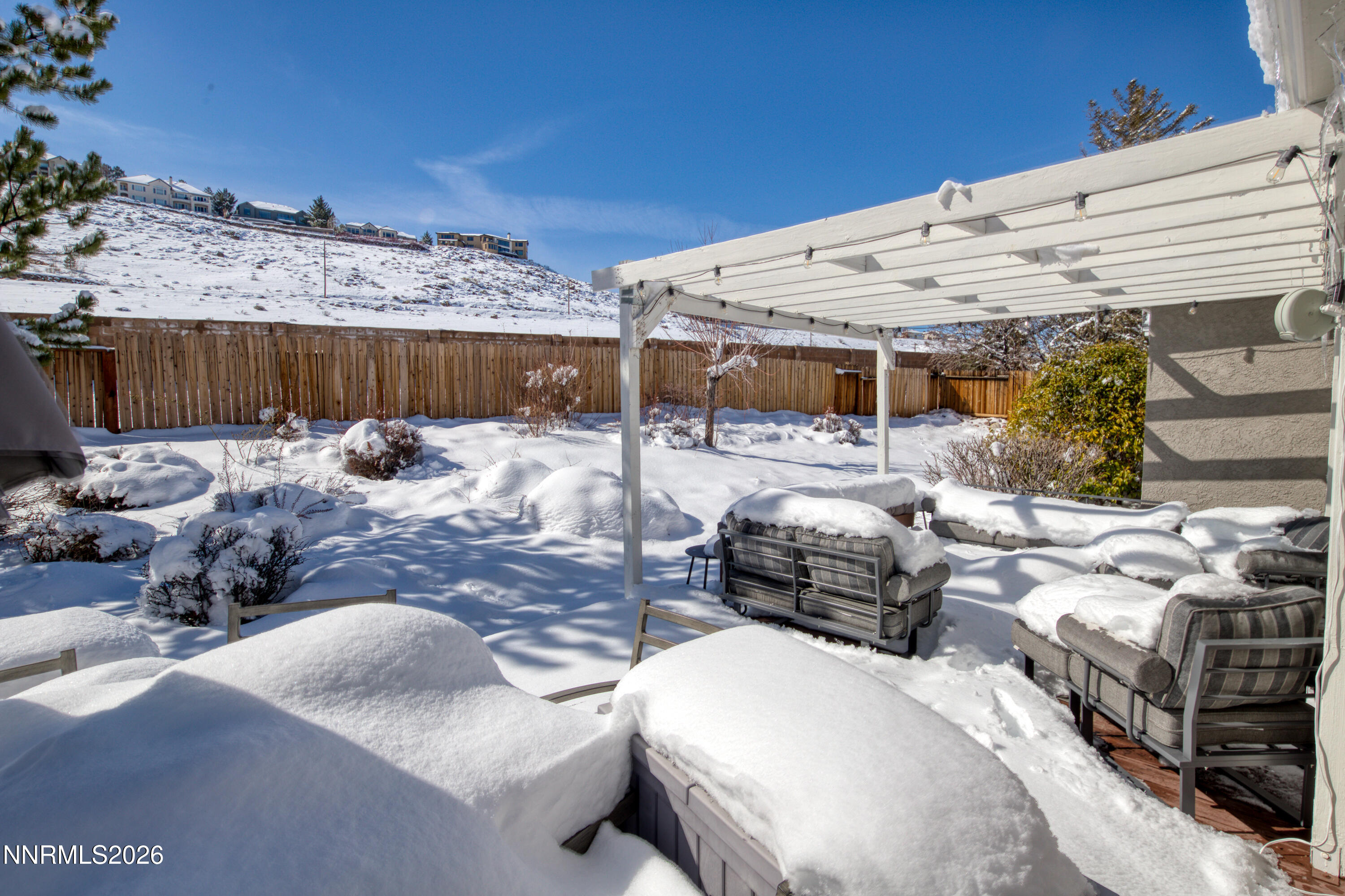 2677 Chaparral Drive Reno, NV 89509 - Photo 29 of 35 a view of a backyard patio and fire pit