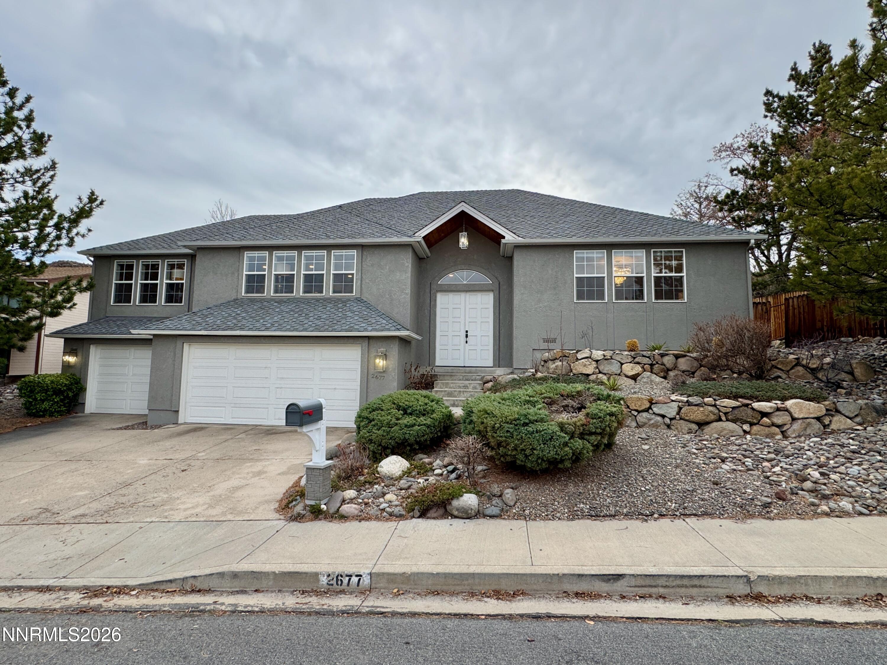 2677 Chaparral Drive Reno, NV 89509 - Photo 34 of 35 a front view of a house with garden
