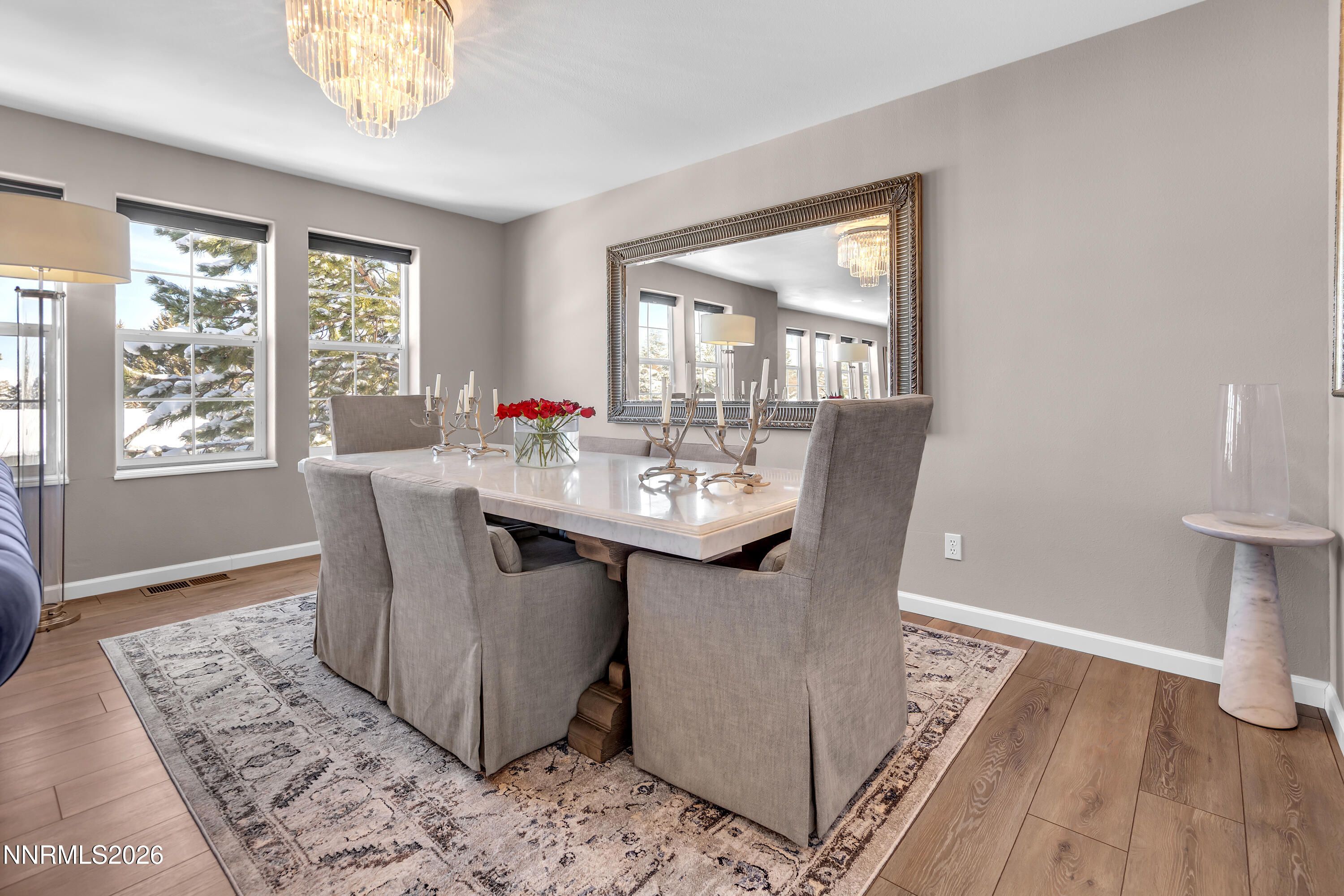 2677 Chaparral Drive Reno, NV 89509 - Photo 5 of 35 a dining room with wooden floor and a chandelier