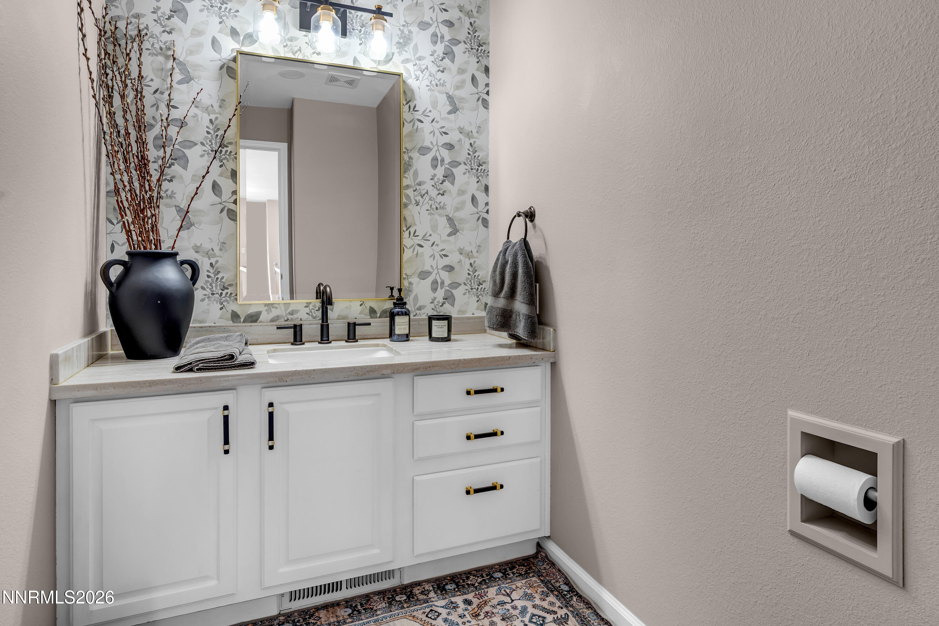 2677 Chaparral Drive Reno, NV 89509 - Photo 10 of 35 a bathroom with a sink and a mirror