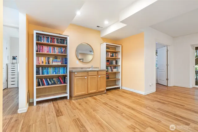 a view of an empty room and a window