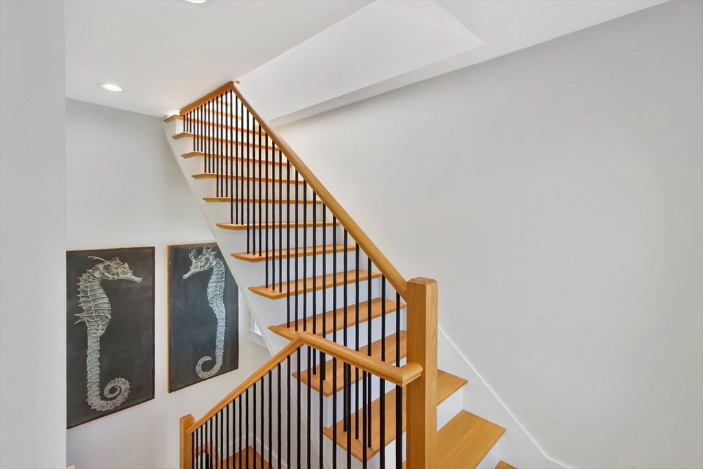 10 Berkley Road, Unit A Hull, MA 02045 - Photo 19 of 25 a view of staircase with railing and a rug