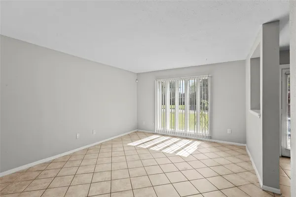 a view of an empty room and window