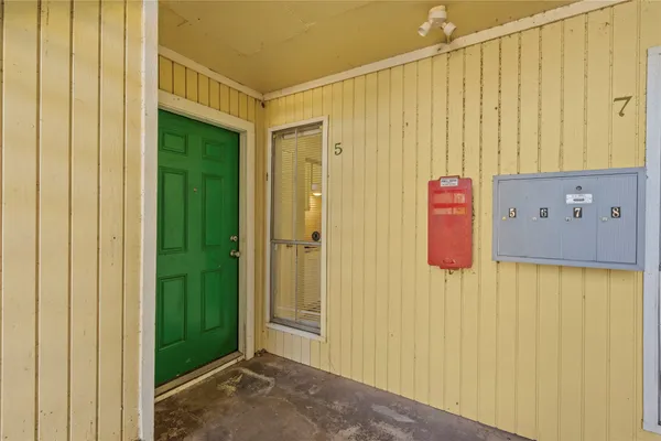 a view of a bathroom with a shower curtain