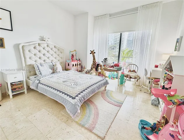 a bedroom with a bed and a table