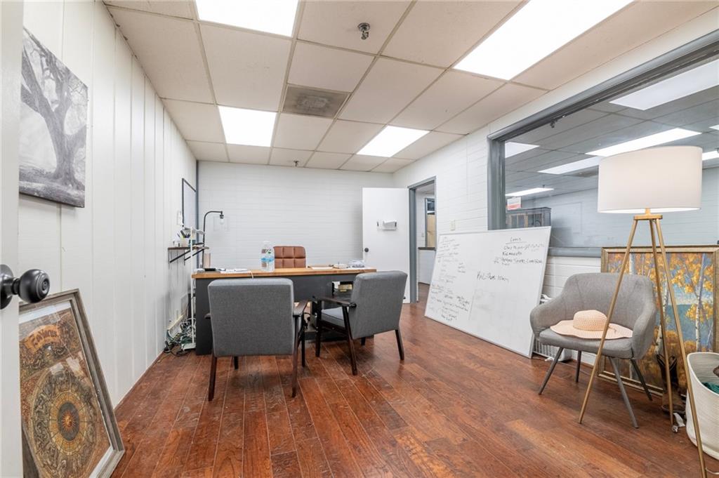 3843 Highway 41 Resaca, GA 30735 - Photo 16 of 23 a living room with furniture a dining table and wooden floor