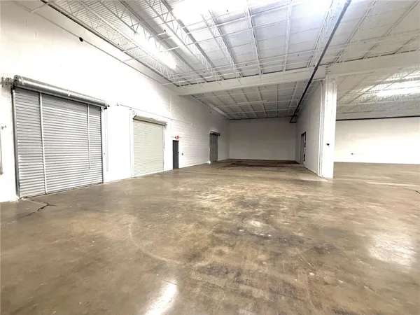 a view of empty room with windows