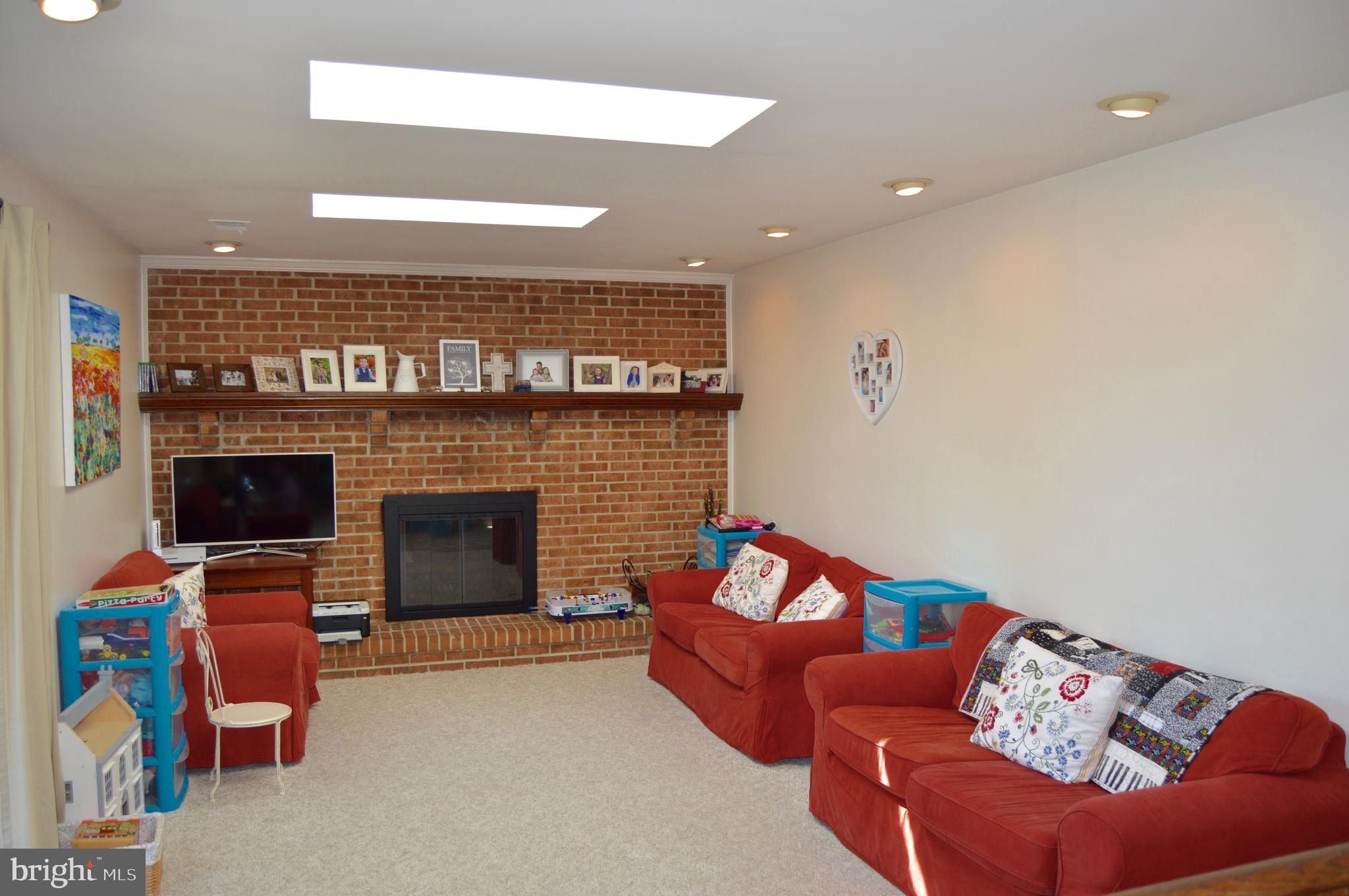2131 Silentree Drive Vienna, VA 22182 - Photo 15 of 25 Family Room with Skylights with Brick Fireplace