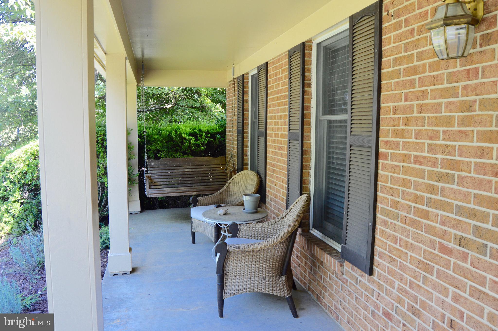 2131 Silentree Drive Vienna, VA 22182 - Photo 3 of 25 Covered Front Porch with Swing Bench