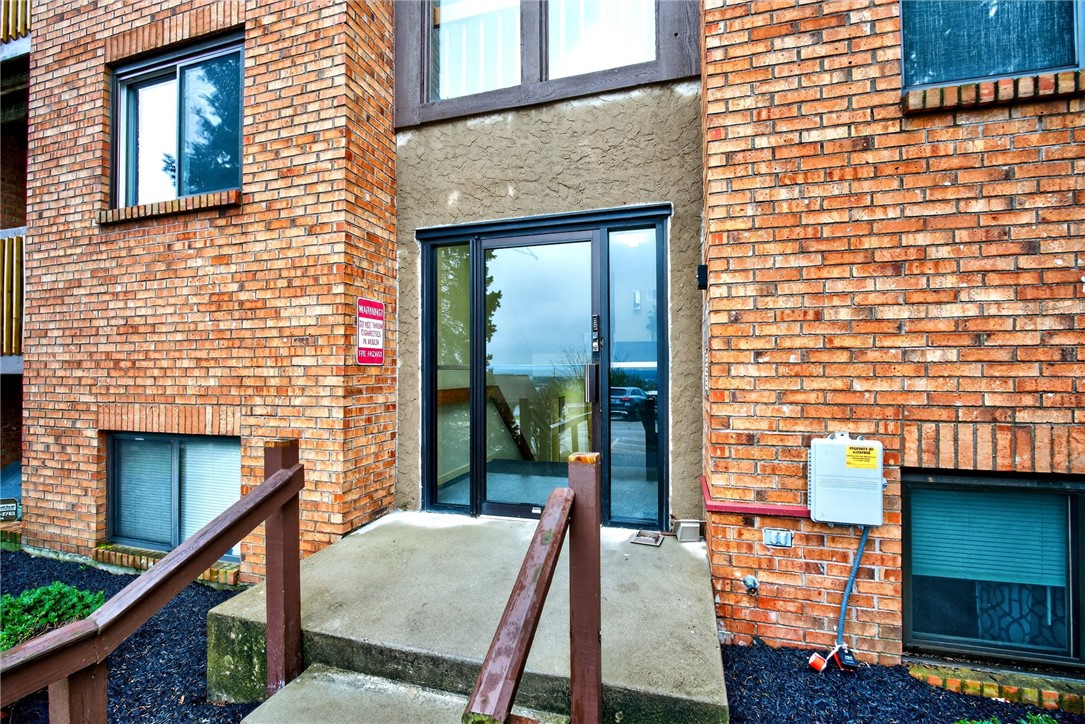 3151 Roesch Boulevard, Unit 6 Fairfield, OH 45014 - Photo 2 of 29 This inviting entrance features durable brick construction and ample natural light, welcoming all who enter.