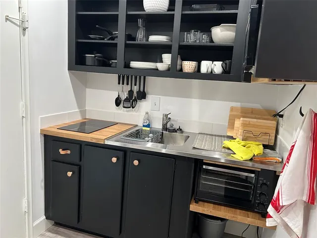 a kitchen with a sink and cabinets
