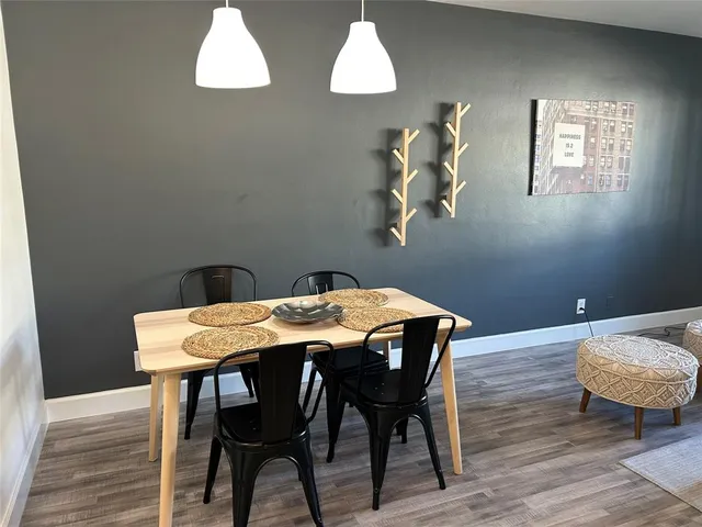 a dining room with furniture and window