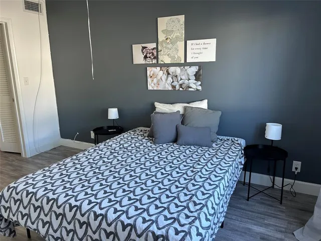 a bedroom with a bed and a table in it