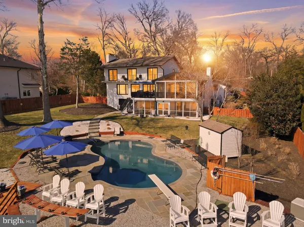 a view of a swimming pool with an outdoor space and garden