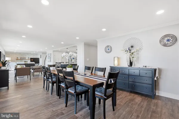 a room with pool table and windows