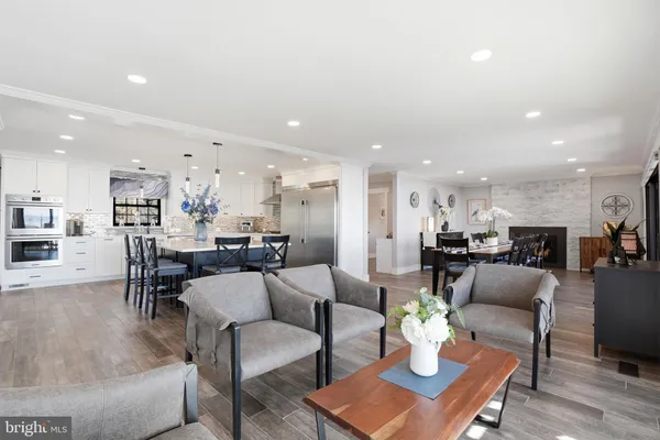 a spacious bedroom with a large bed and a flat tv screen