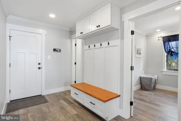 a bathroom with a tub shower and mirror
