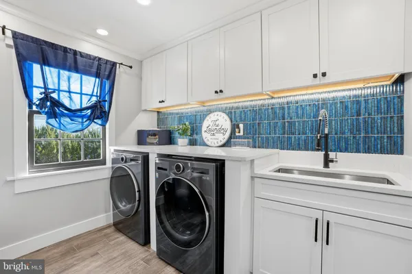 a bathroom with a double vanity sink and a mirror