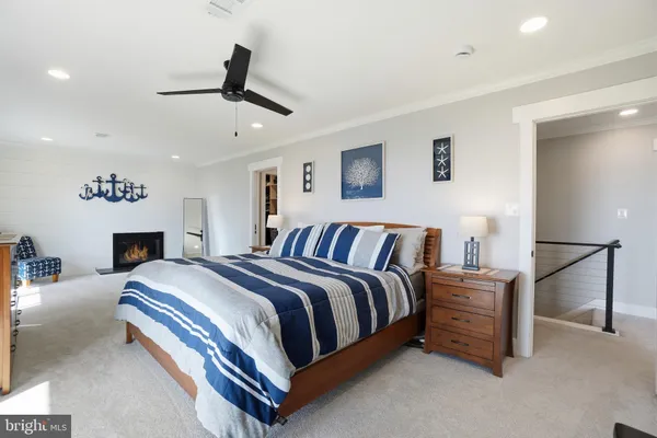 a bathroom with a shower sink vanity mirror and toilet