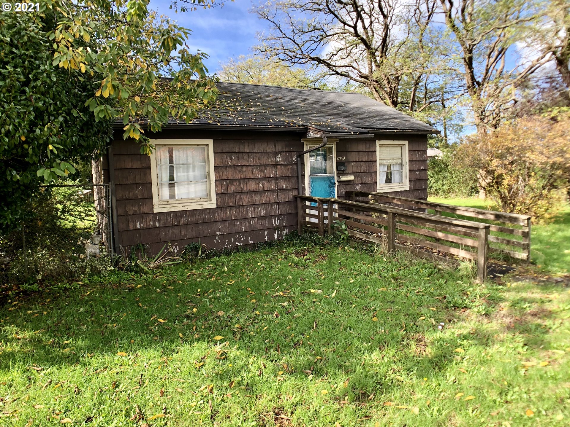 2964 Broadway Avenue North Bend, OR 97459 - Photo 3 of 6 a front view of a house with a garden
