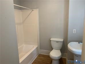 3317 Waverly Boulevard, Unit B Richmond, VA 23222 - Photo 11 of 36 a white toilet sitting next to a bath tub