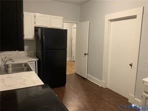 3317 Waverly Boulevard, Unit B Richmond, VA 23222 - Photo 14 of 36 a kitchen with a refrigerator and a stove top oven