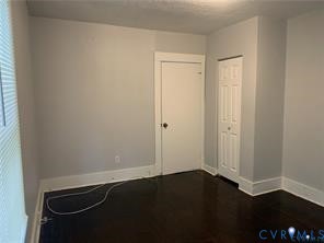 3317 Waverly Boulevard, Unit B Richmond, VA 23222 - Photo 24 of 36 an empty room with wooden floor