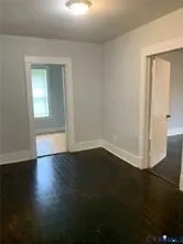 a white toilet sitting next to a bathroom sink