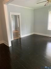 3317 Waverly Boulevard, Unit B Richmond, VA 23222 - Photo 3 of 36 an empty room with wooden floor and windows
