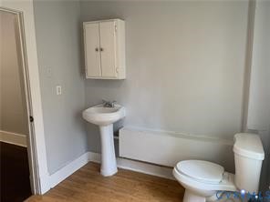 3317 Waverly Boulevard, Unit B Richmond, VA 23222 - Photo 31 of 36 a bathroom with a sink toilet and a mirror