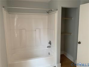 3317 Waverly Boulevard, Unit B Richmond, VA 23222 - Photo 32 of 36 a bathroom with a shower and a bath tub