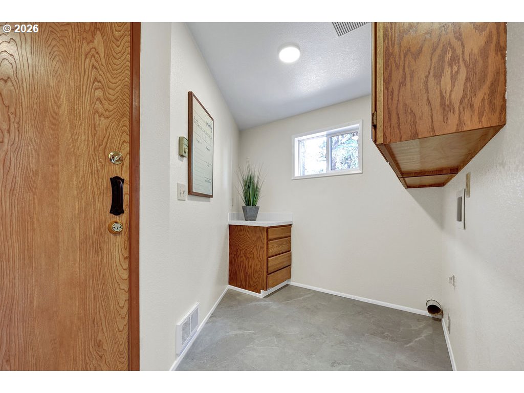 2372 South 22nd Court Florence, OR 97439 - Photo 27 of 33 a view of an empty room with wooden floor and a window