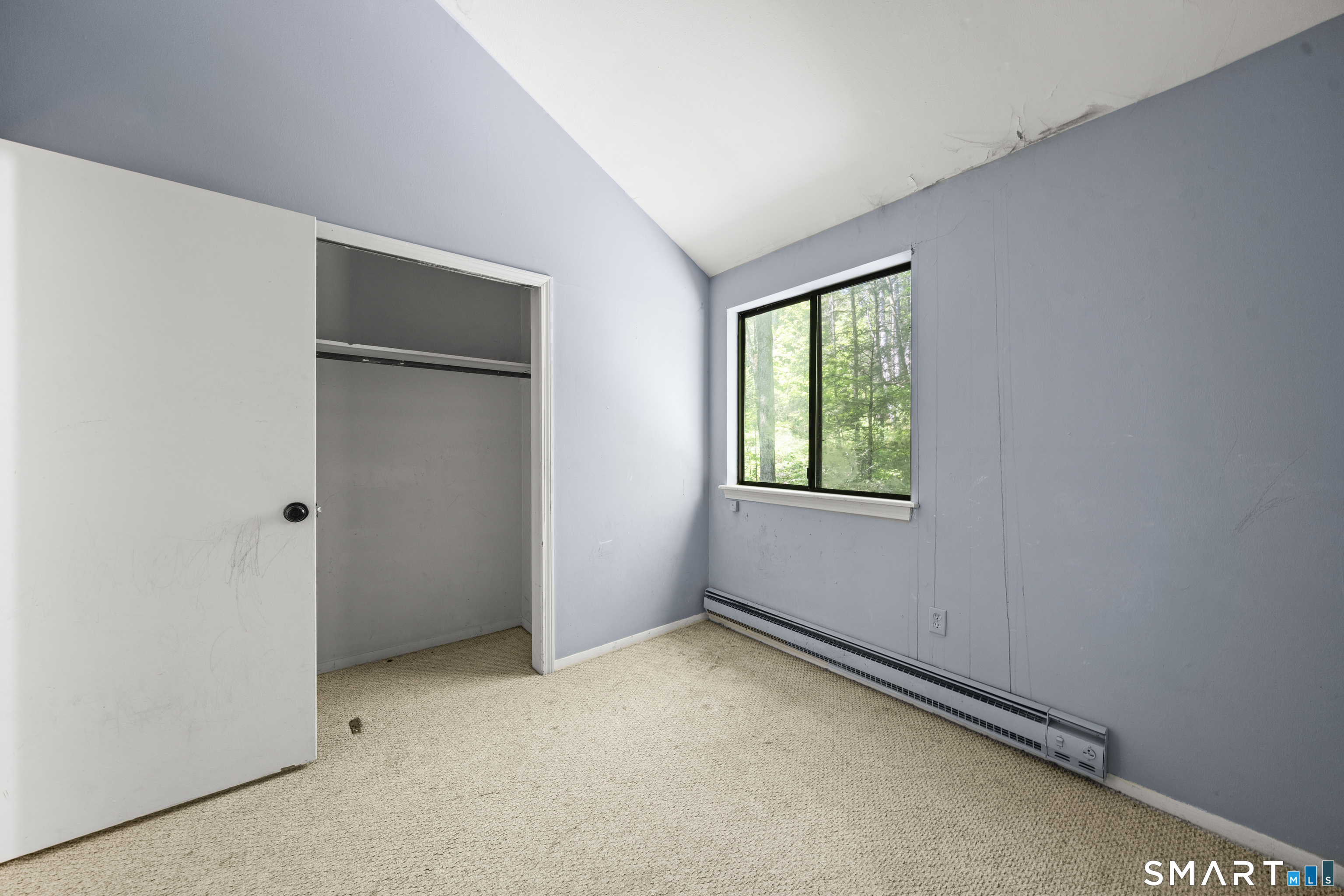 39 Evergreen Road, Unit 39 Torrington, CT 06790 - Photo 10 of 27 a view of an empty room with a window