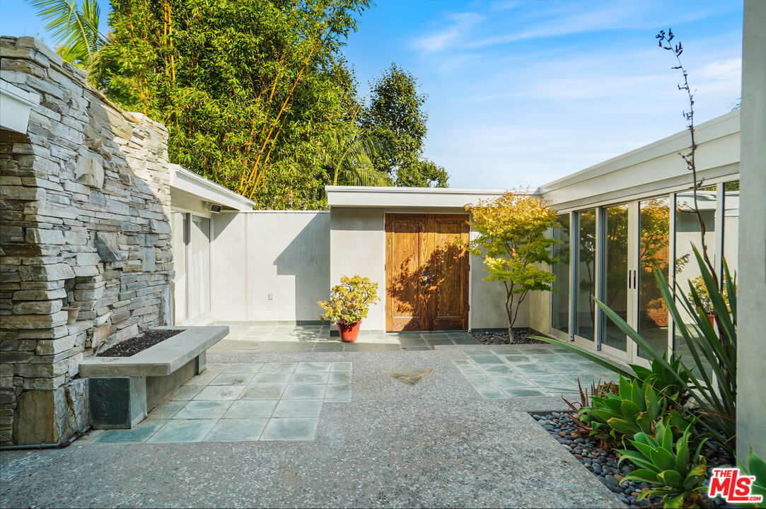 30725 Manzano Drive Malibu, CA 90265 - Photo 13 of 51 a view of a house with porch and garden