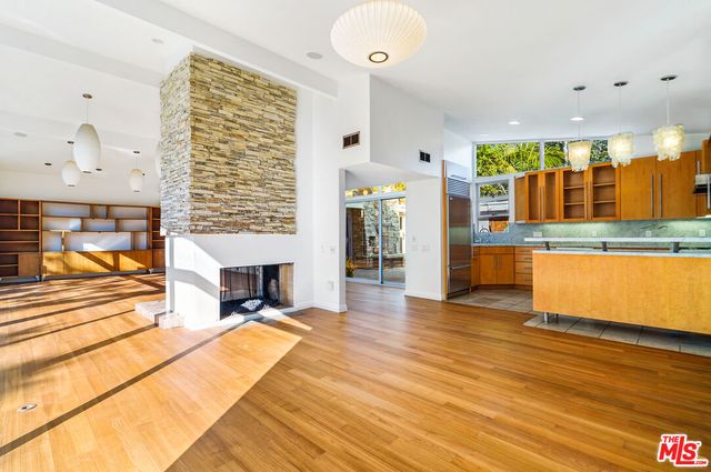a view of a living room and kitchen with furniture