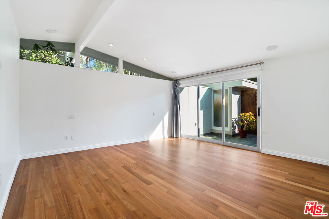 30725 Manzano Drive Malibu, CA 90265 - Photo 27 of 51 a view of an empty room with wooden floor