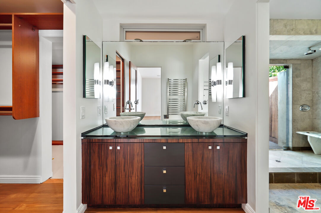 30725 Manzano Drive Malibu, CA 90265 - Photo 29 of 51 a bathroom with a granite countertop sink and a mirror
