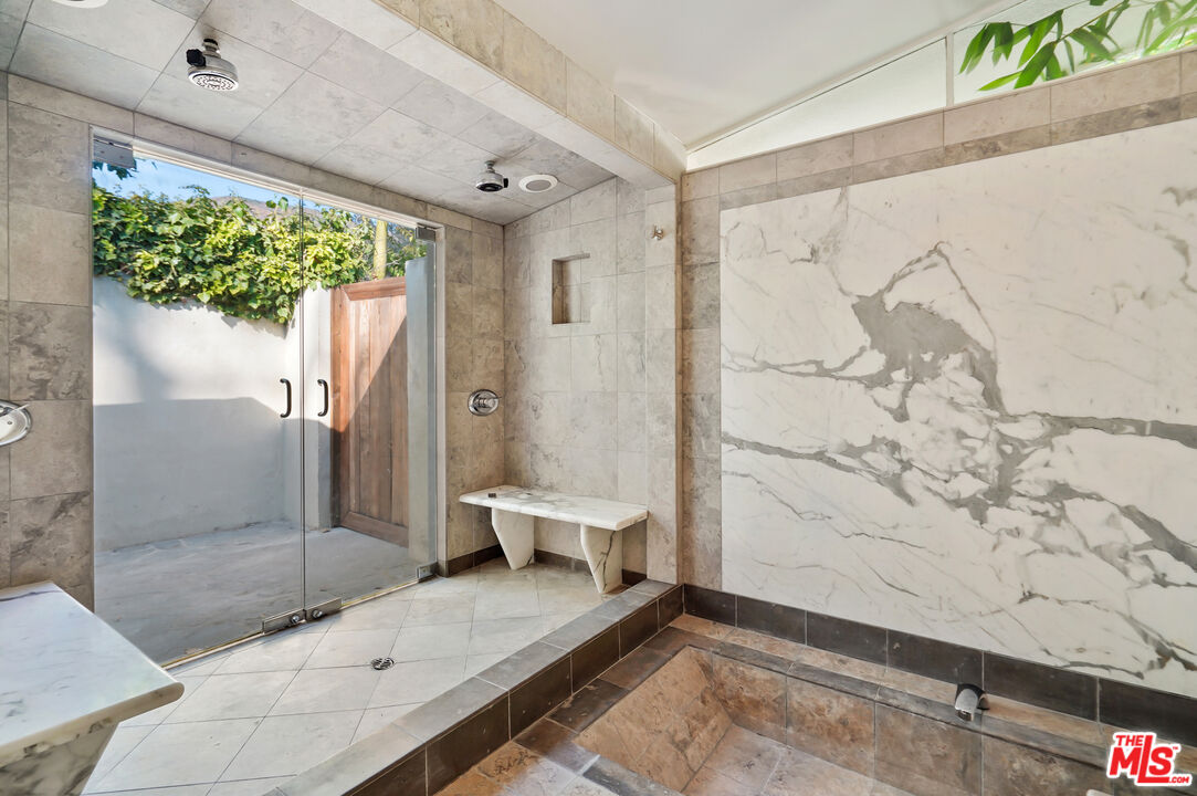30725 Manzano Drive Malibu, CA 90265 - Photo 30 of 51 a bathroom with a granite countertop sink a toilet and shower