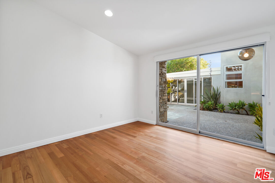 30725 Manzano Drive Malibu, CA 90265 - Photo 34 of 51 wooden floor in an empty room with a window