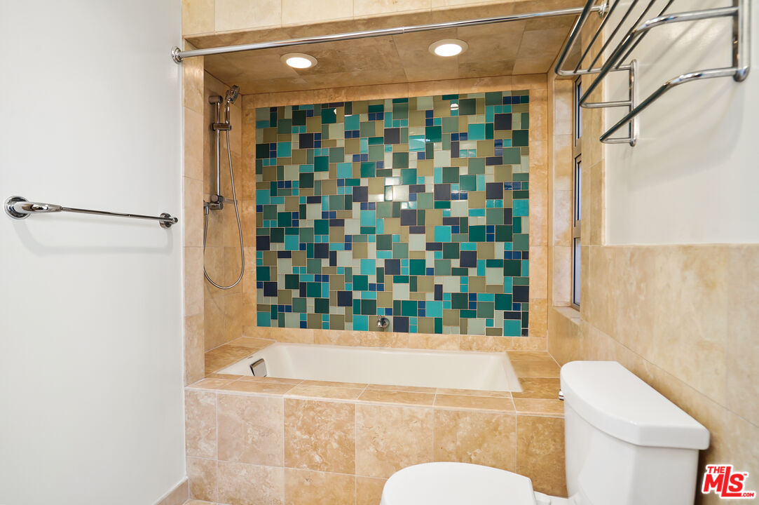 30725 Manzano Drive Malibu, CA 90265 - Photo 37 of 51 a bathroom with a bathtub and shower