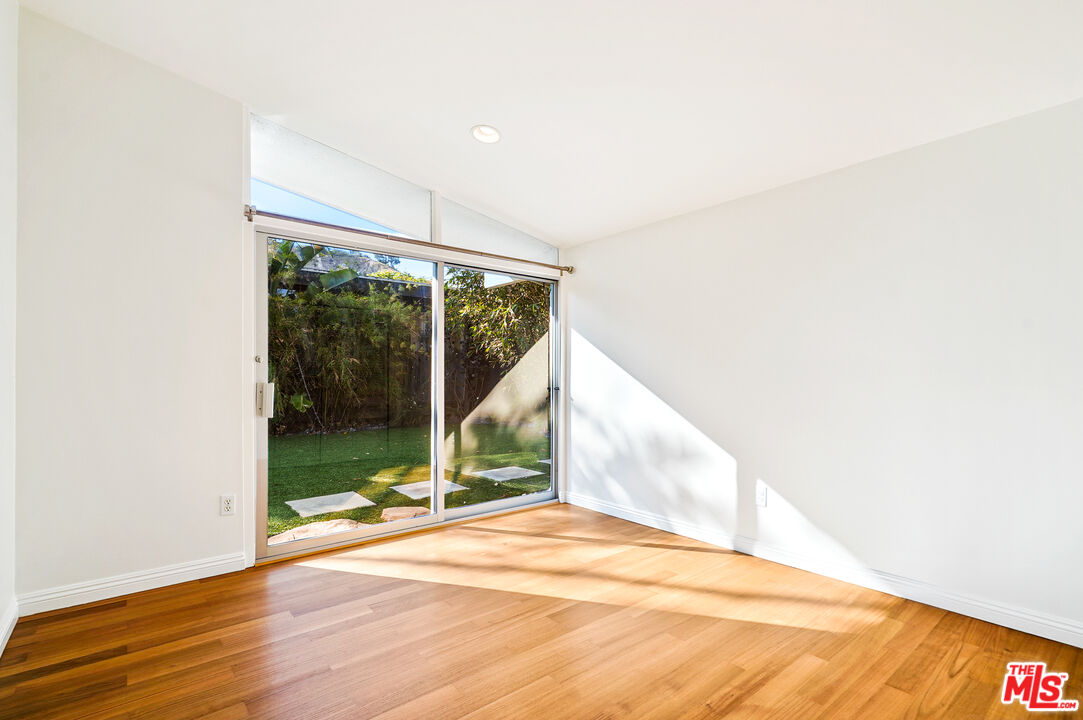 30725 Manzano Drive Malibu, CA 90265 - Photo 38 of 51 a view of a room with wooden floor and white walls