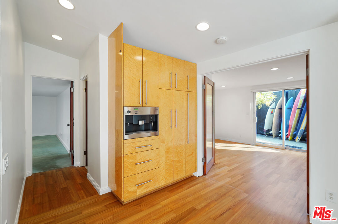 30725 Manzano Drive Malibu, CA 90265 - Photo 40 of 51 a view of a hallway with wooden floor and a bathroom