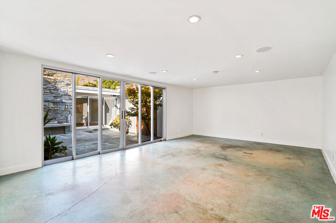 30725 Manzano Drive Malibu, CA 90265 - Photo 43 of 51 a view of an empty room with a sliding door